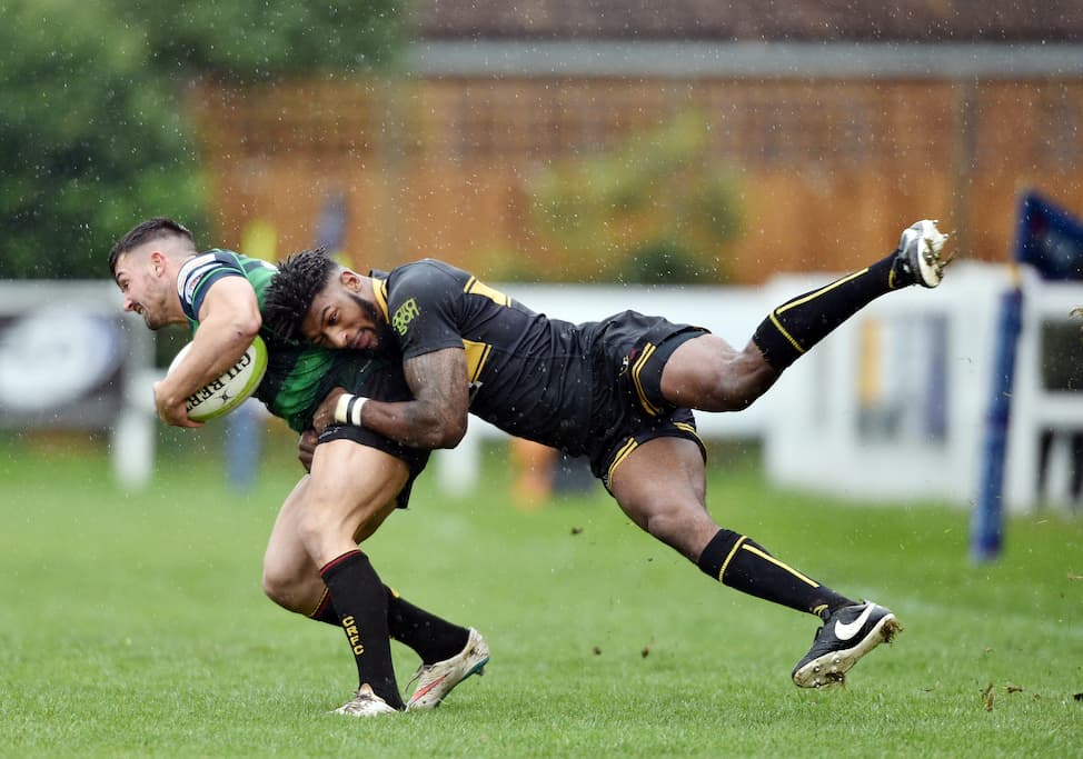 Rugby tackle in progress