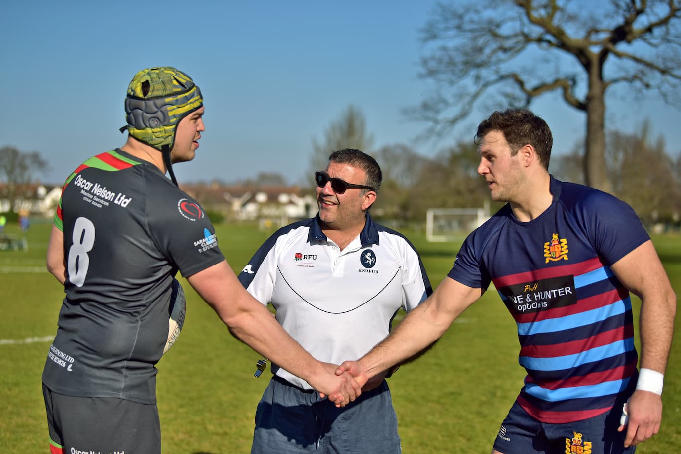 Rugby referee officiating the coin toss