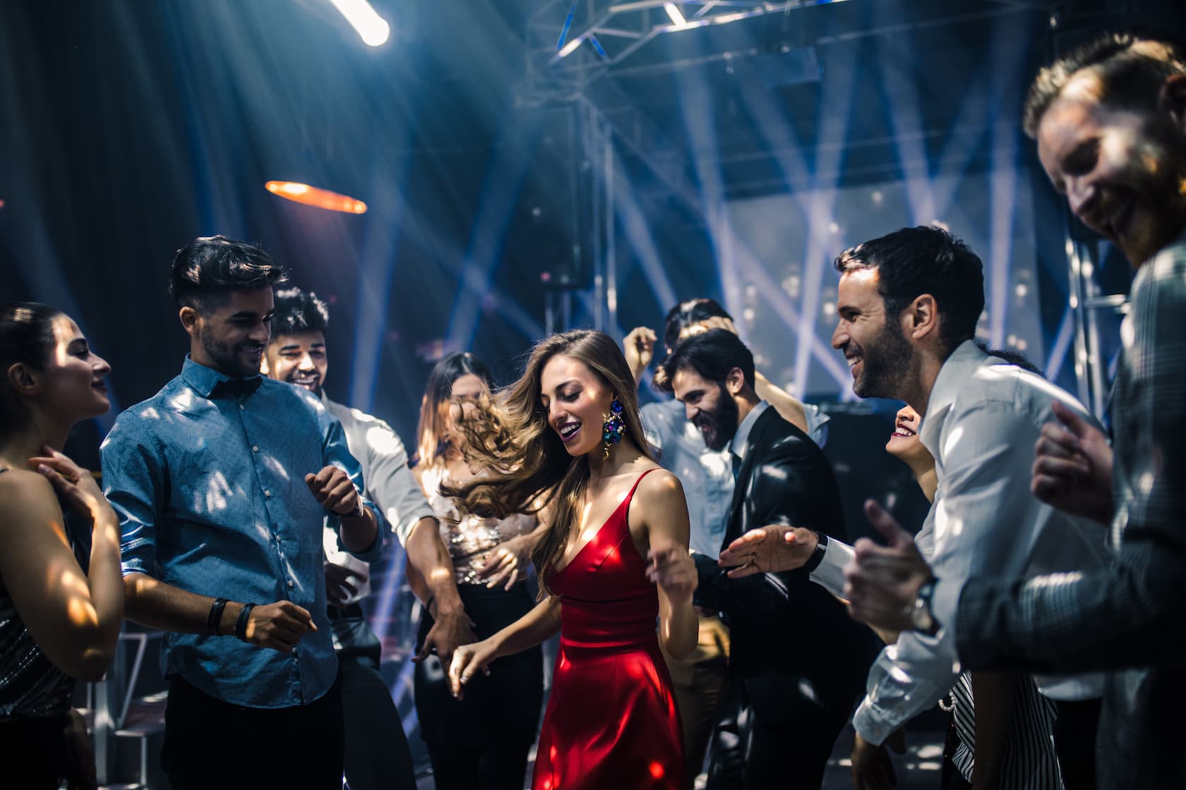 People dancing under disco lights