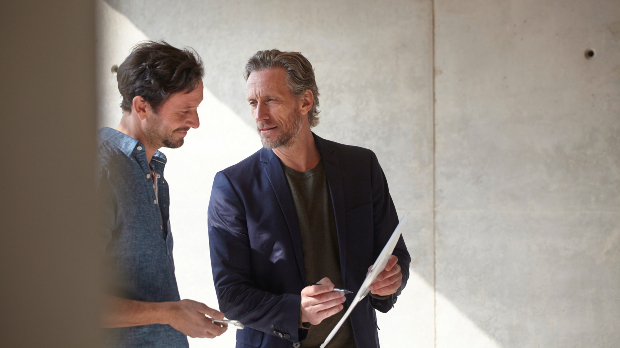 two business people discussing on a bright day