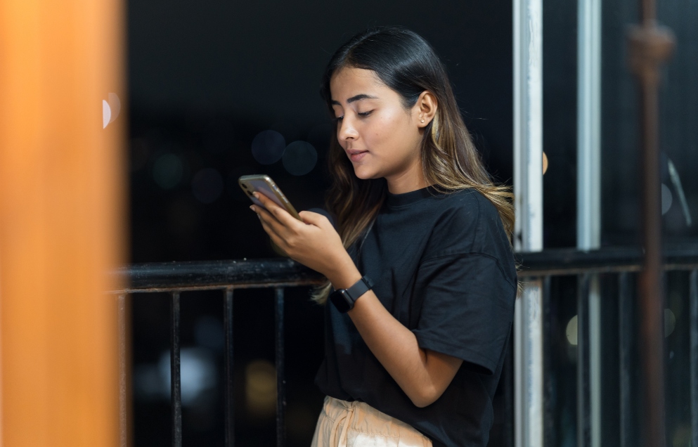 young person looking at their phone