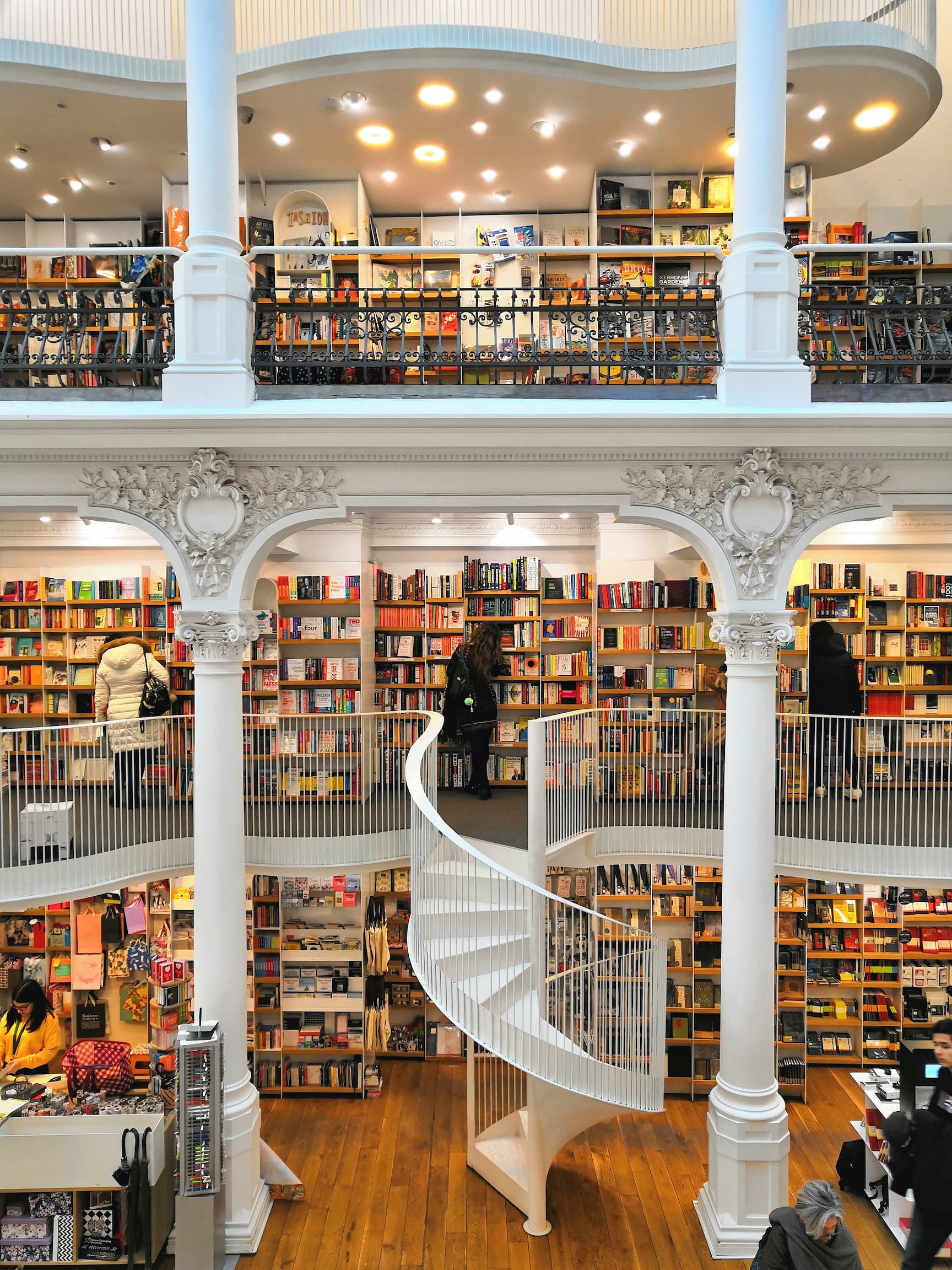 multi-floored library with ceiling height bookcases