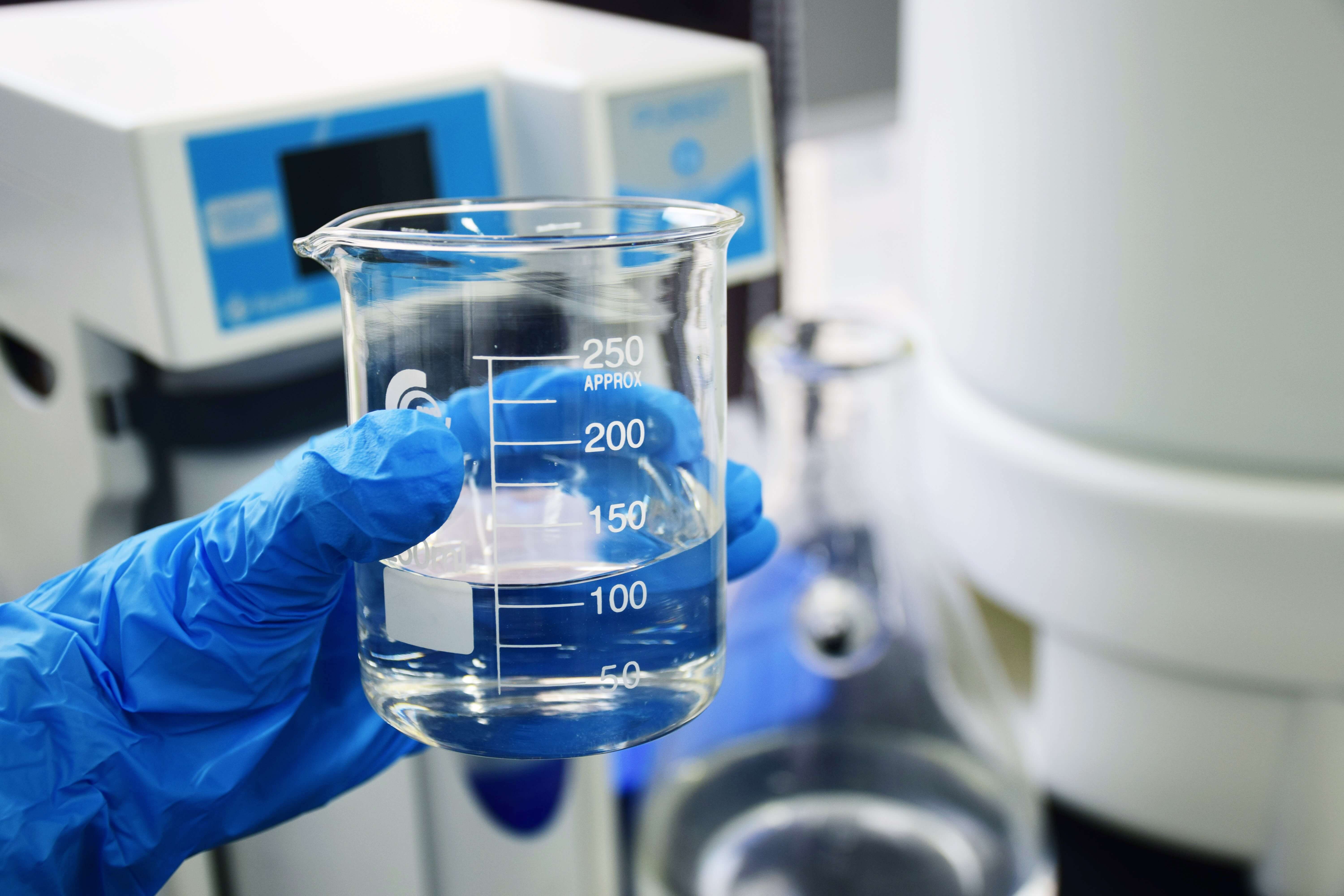 A beaker of chemicals in a lab