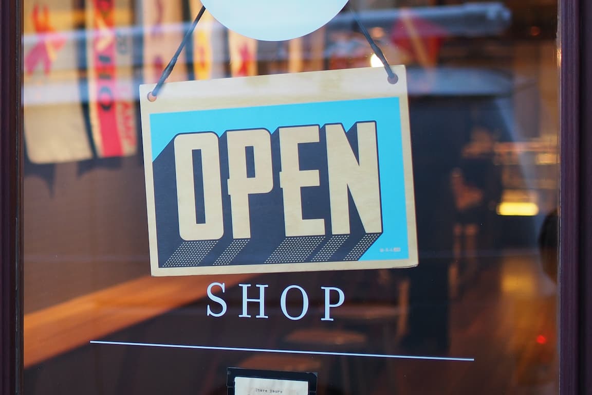 open sign on glass door of shop
