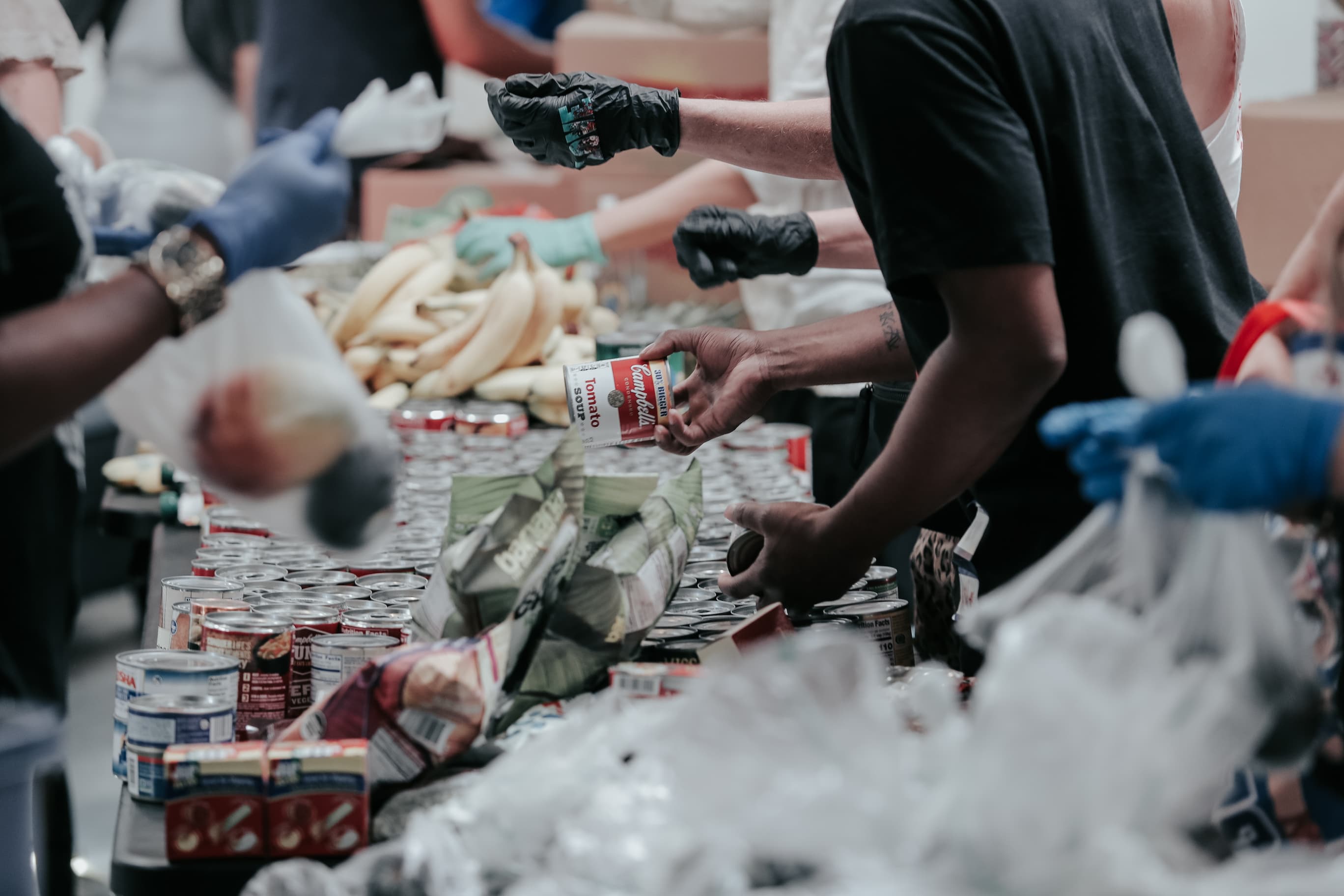 People handing out bags of food in a foodbank