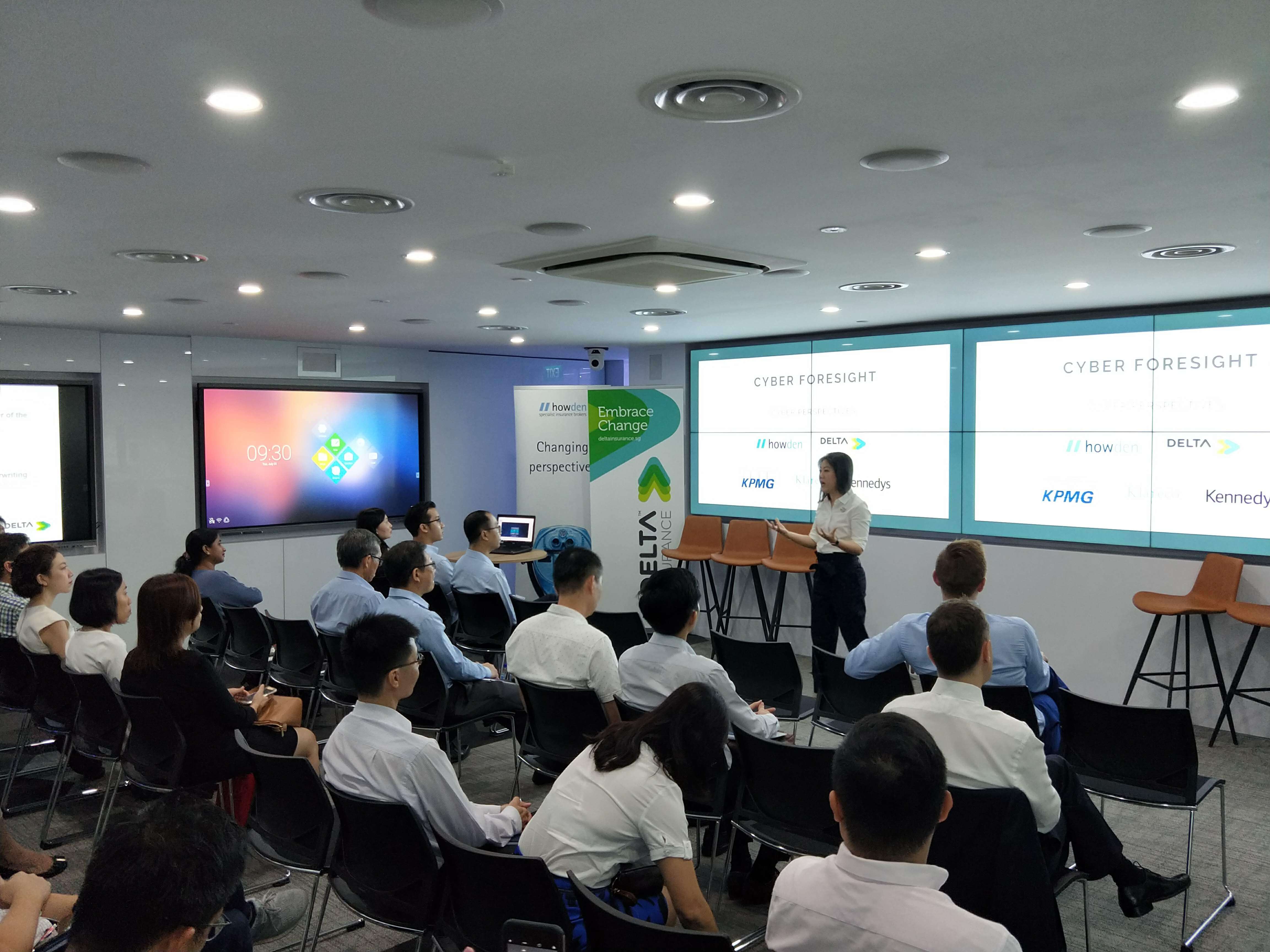 Jenny Lim presenting to an audience at the KPMG event