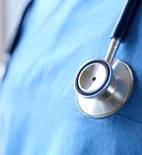 Stethoscope on doctor chest