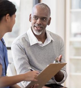Patient and nurse discussing good news