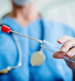 nurse doing swab testing