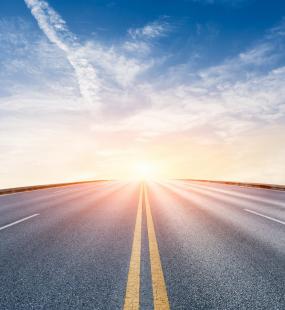 road leading into the sunset - road to recovery - Howden