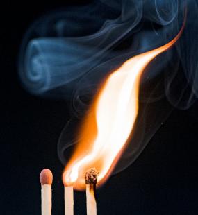 Three matches, with two alight and one unlit