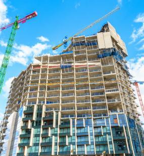 High-rise building under construction and crane