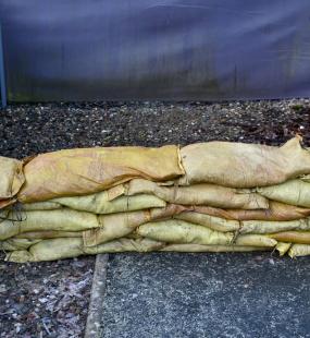 Sandbags laid by external wall as flood defence