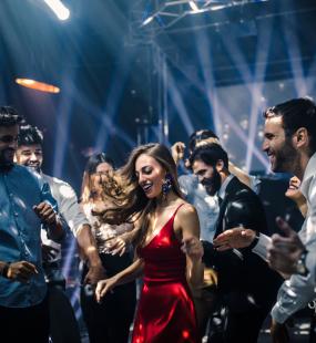 People dancing under disco lights