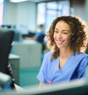 Nurse sitting infront of computer screen