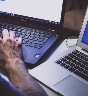 employee protecting computers with cyber-securty