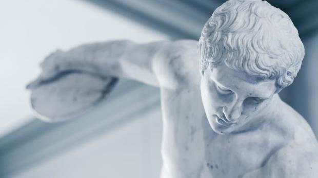 A close-up of the Townley Discobolus: a marble statue of an athlete preparing to throw a discus