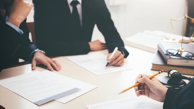 Solicitors signing contracts