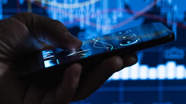 man holding mobile phone technical