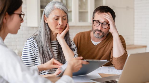 Worried Couple talking to Solicitor