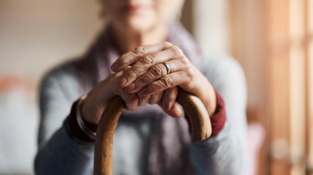 Lady with a walking cane