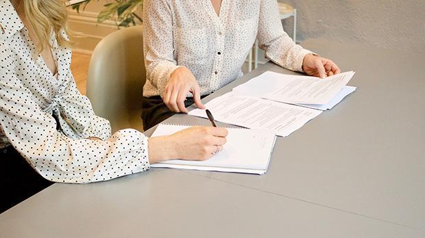 A person signing a document