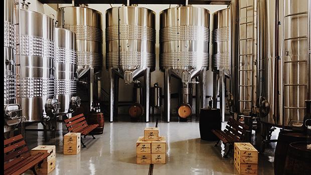 Inside of a brewery showing brewing tanks